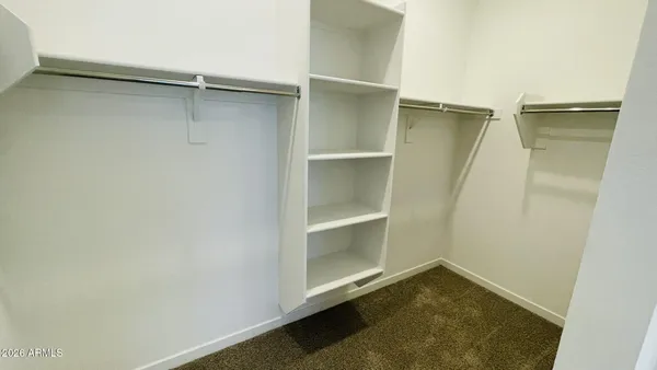 a bathroom with a double vanity sink a and mirror