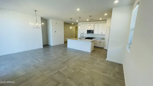 a view of a bathroom with a sink and a shower