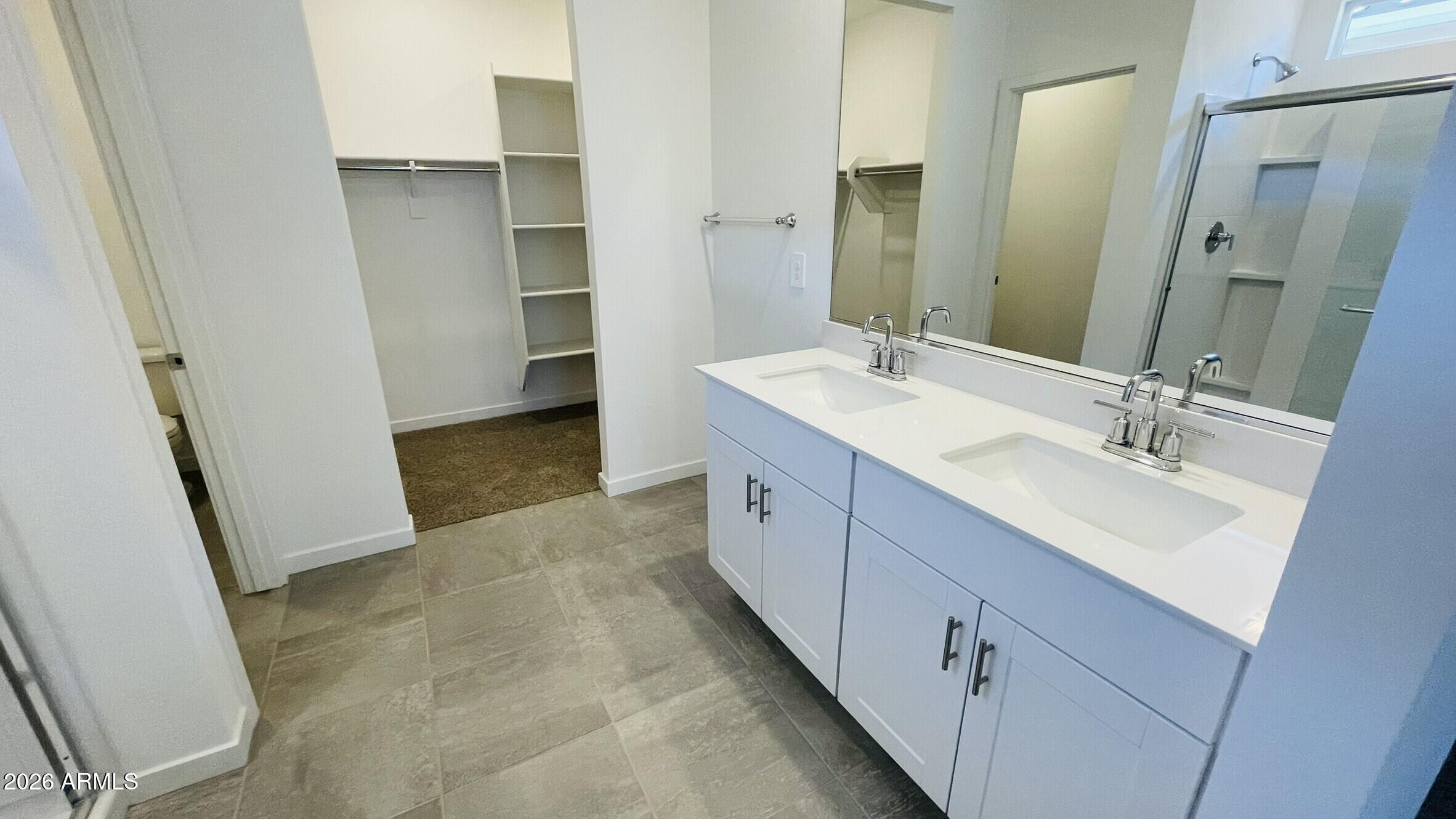 36972 West Prado Street Maricopa, AZ 85138 - Photo 9 of 18 a bathroom with a double vanity sink a and mirror