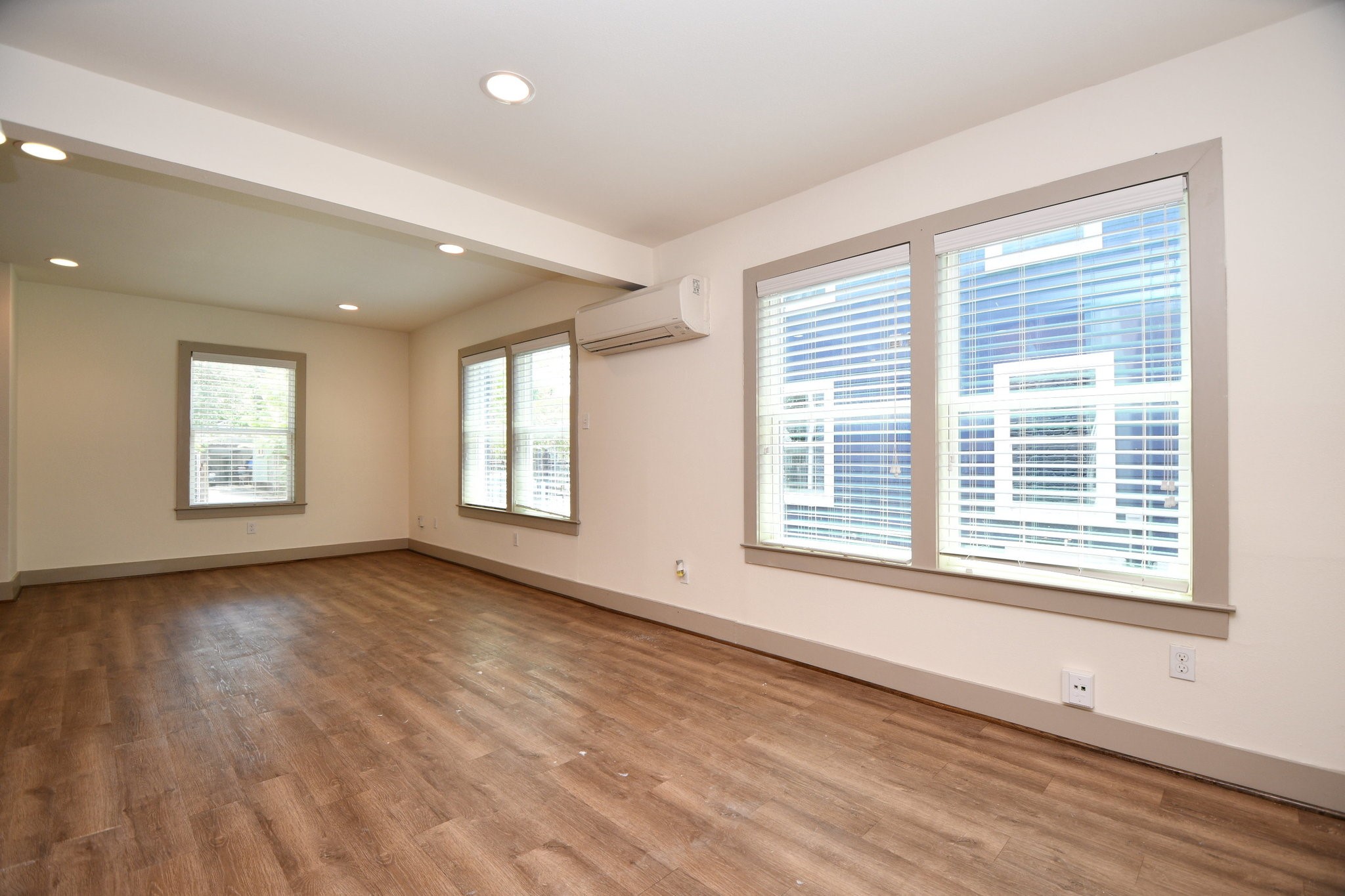 1011 Enid Street, Unit 2 Houston, TX 77009 - Photo 3 of 14 Living/dining combination with laminate floors and fresh paint throughout.