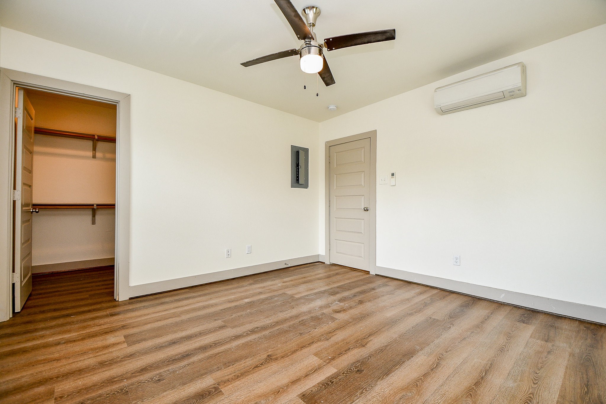 1011 Enid Street, Unit 2 Houston, TX 77009 - Photo 8 of 14 Bedroom with mini-split hotel-style air conditioner.