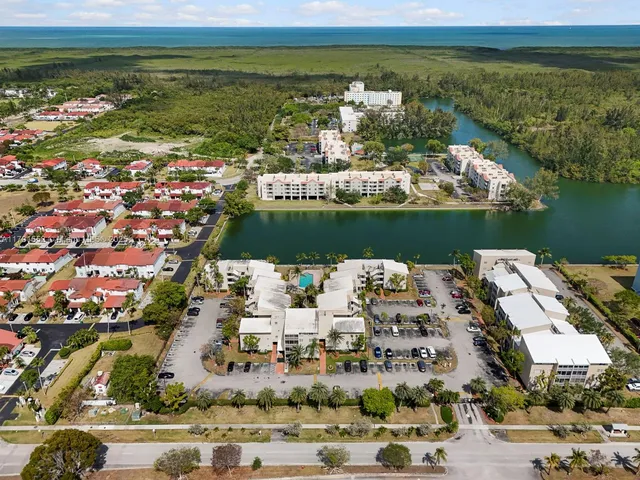 an aerial view of a houses with yard
