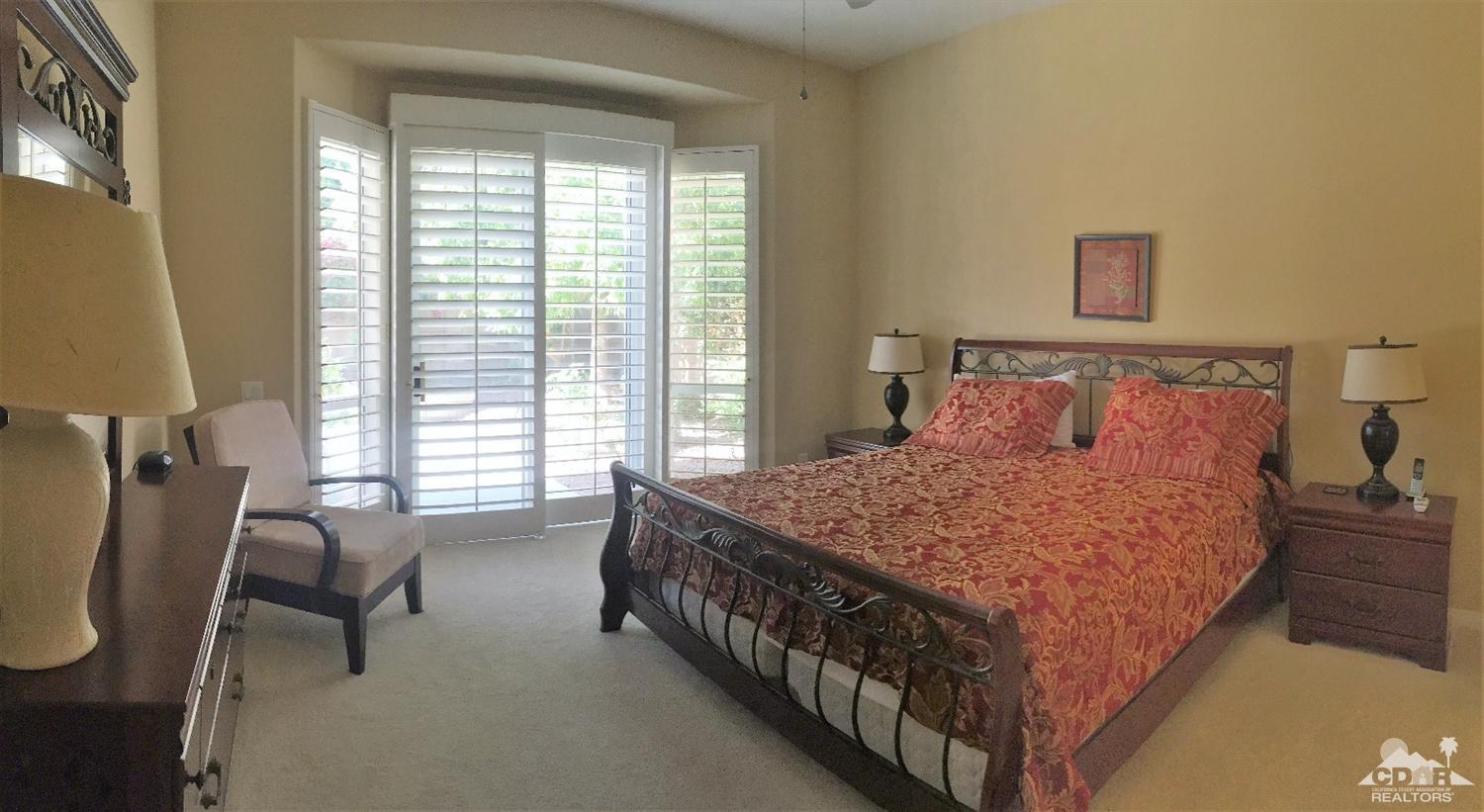37235 Skycrest Road Palm Desert, CA 92211 - Photo 18 of 34 a bedroom with a bed a chair and next to a window