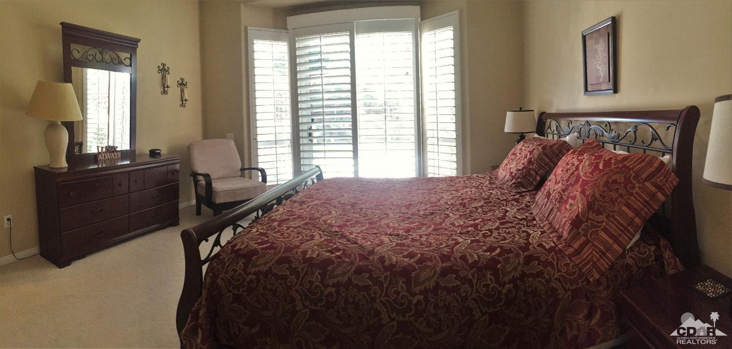 37235 Skycrest Road Palm Desert, CA 92211 - Photo 19 of 34 a bed sitting in a bedroom next to a window