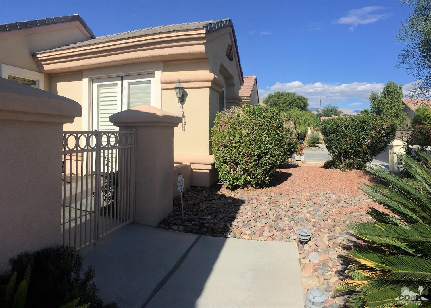 37235 Skycrest Road Palm Desert, CA 92211 - Photo 3 of 34 a view of a house with a small yard and plants