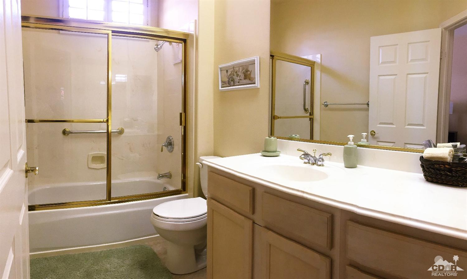 37235 Skycrest Road Palm Desert, CA 92211 - Photo 27 of 34 a bathroom with a sink toilet and shower