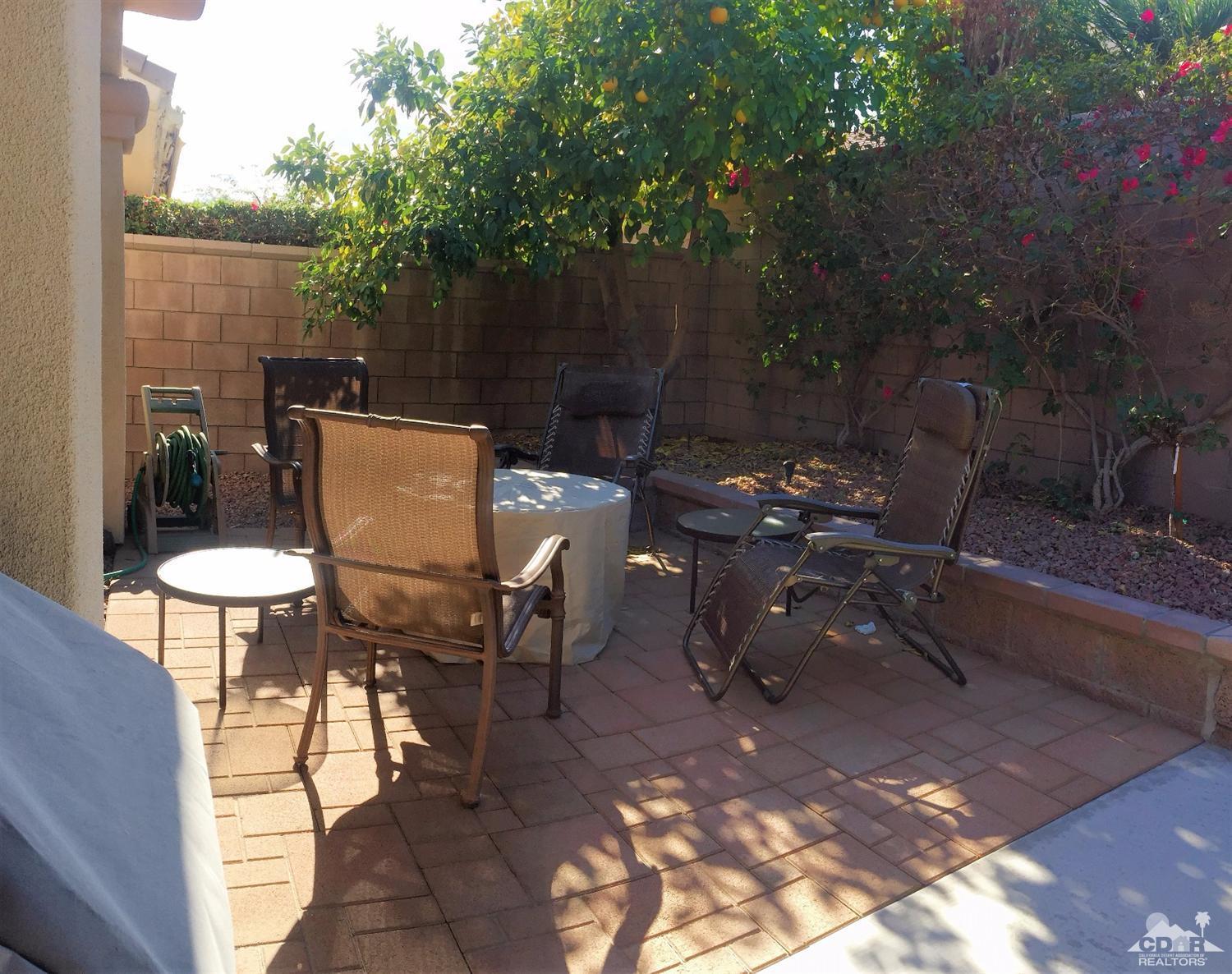 37235 Skycrest Road Palm Desert, CA 92211 - Photo 31 of 34 a backyard of a house with outdoor seating