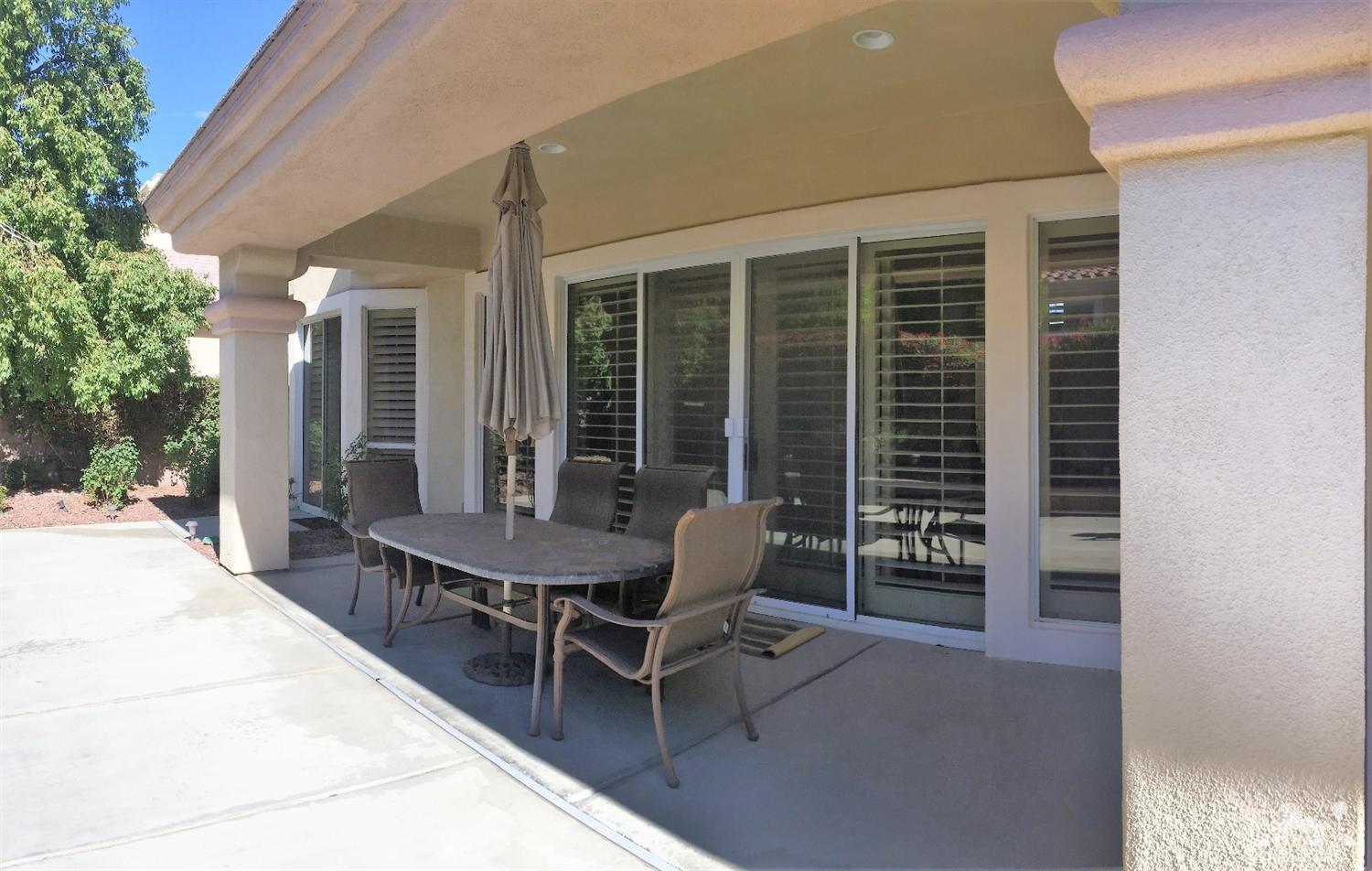 37235 Skycrest Road Palm Desert, CA 92211 - Photo 34 of 34 a view of a patio with table and chairs and potted plants