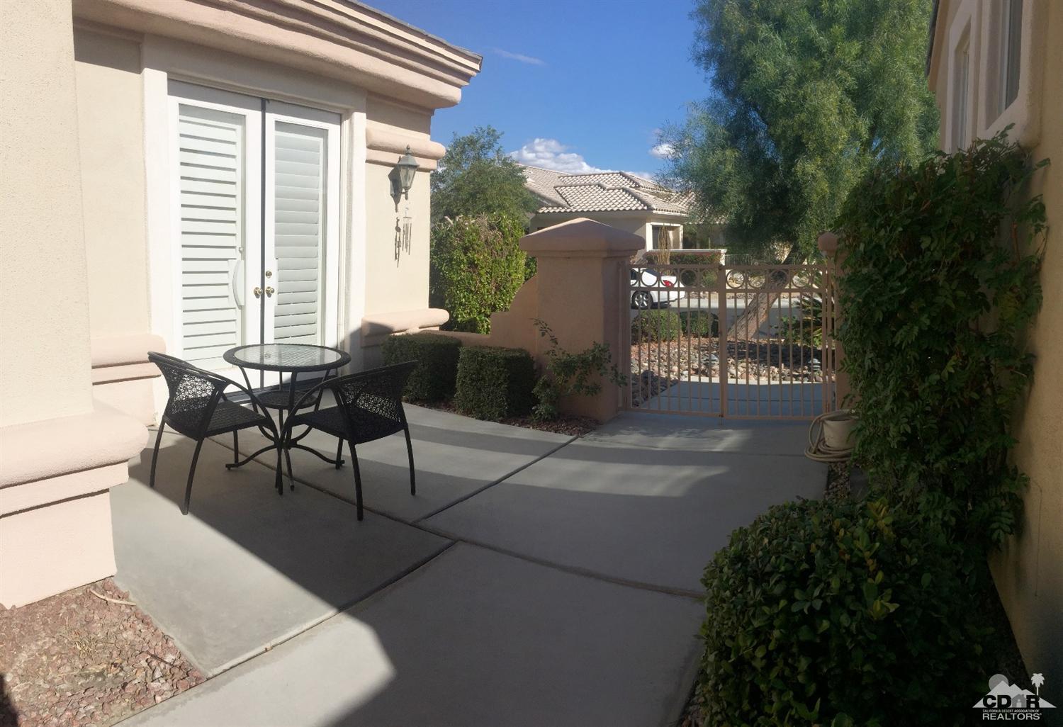 37235 Skycrest Road Palm Desert, CA 92211 - Photo 5 of 34 a roof deck with table and chairs and potted plants