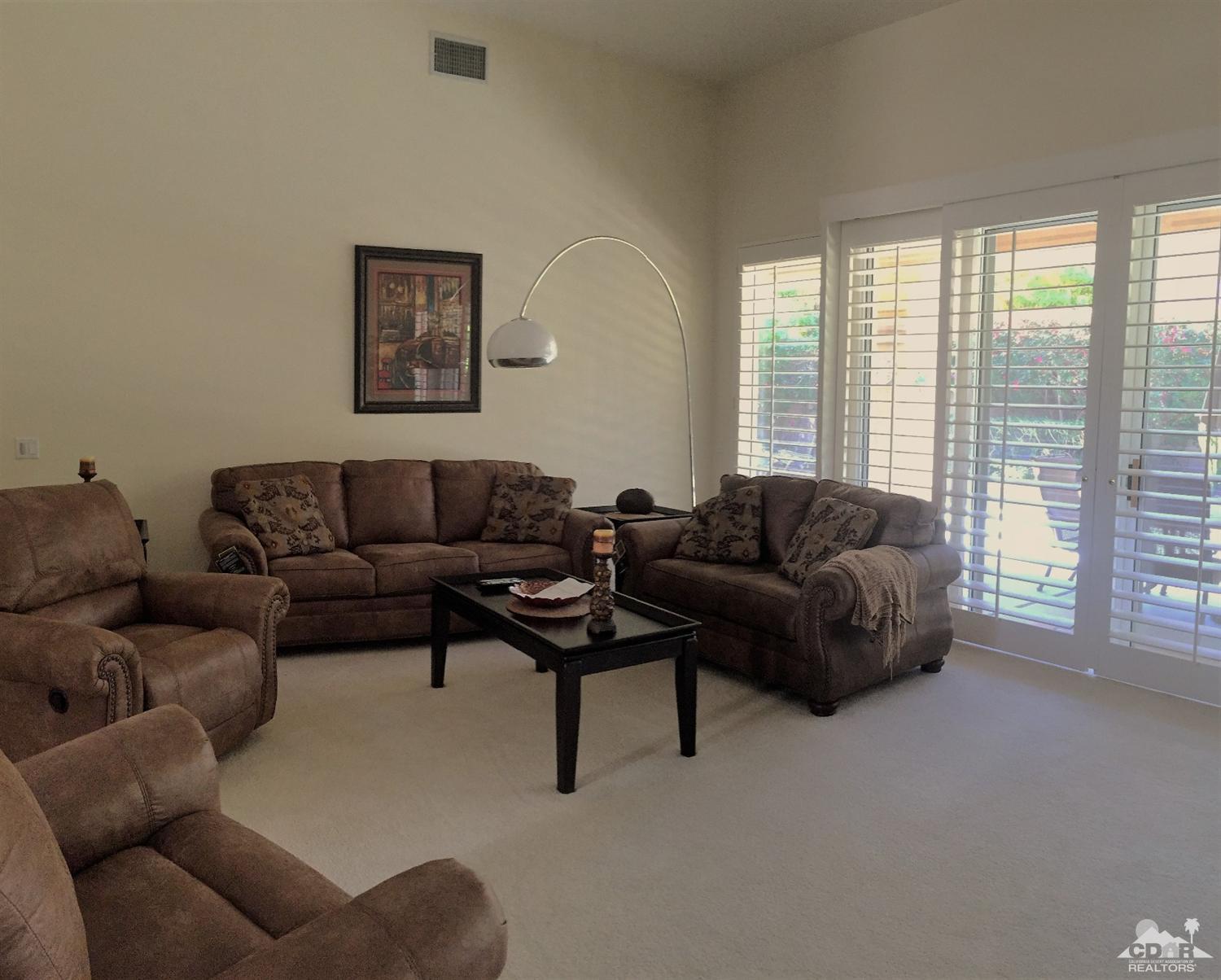 37235 Skycrest Road Palm Desert, CA 92211 - Photo 8 of 34 a living room with furniture and a large window