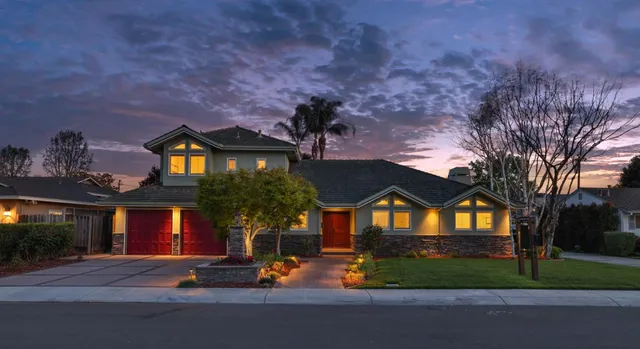 a front view of a house with a yard