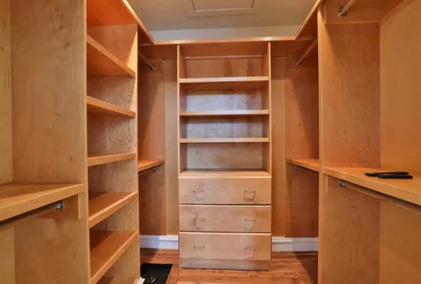 a living room with a couch and a potted plant