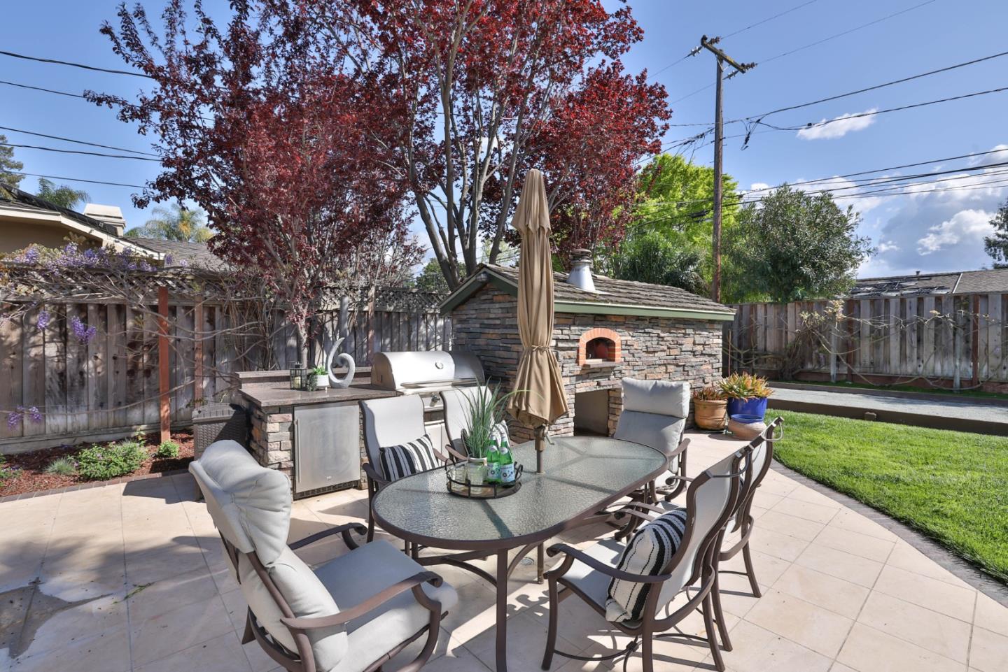 1870 Patio Drive San Jose, CA 95125 - Photo 45 of 47 a view of a patio with table and chairs potted plants and large tree