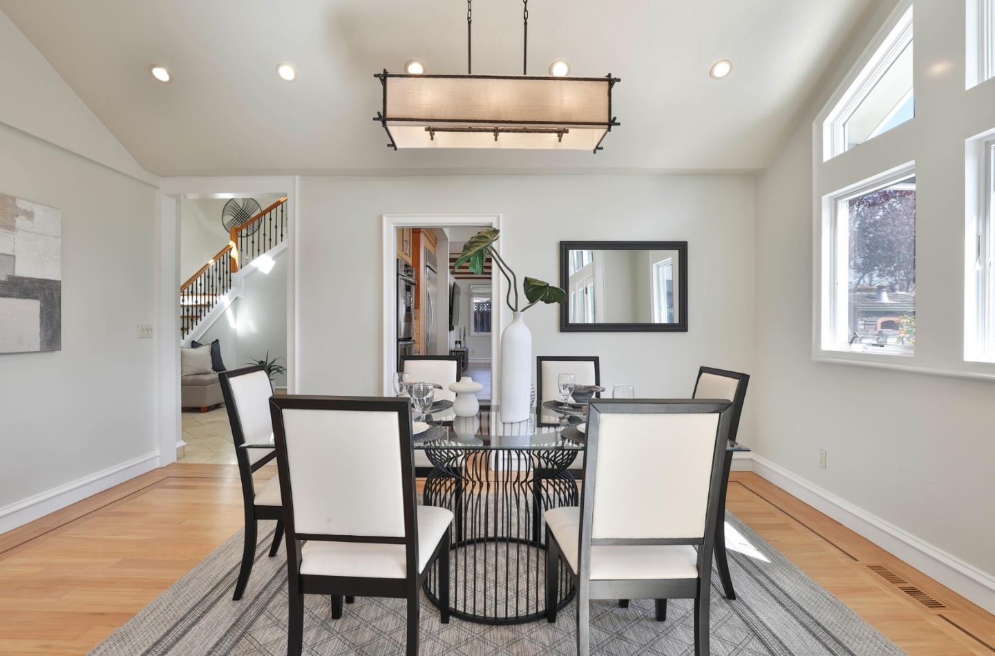 1870 Patio Drive San Jose, CA 95125 - Photo 8 of 47 a view of a dining room with furniture wooden floor and chandelier