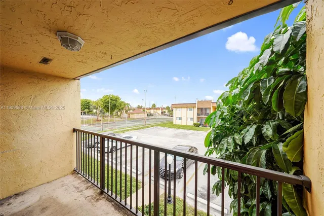 a view of balcony with wooden floor