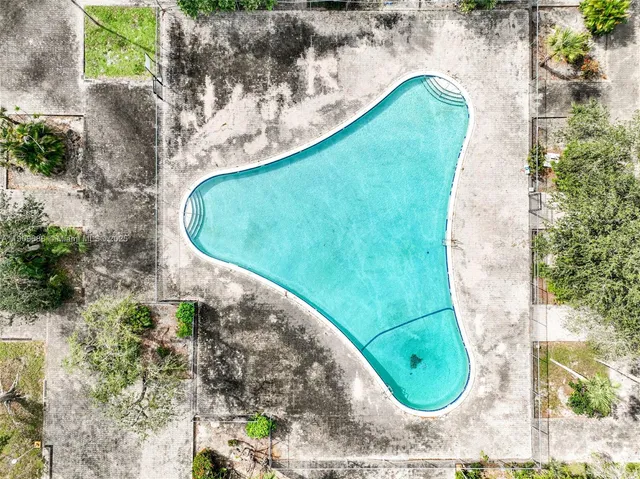 an aerial view of a swimming pool