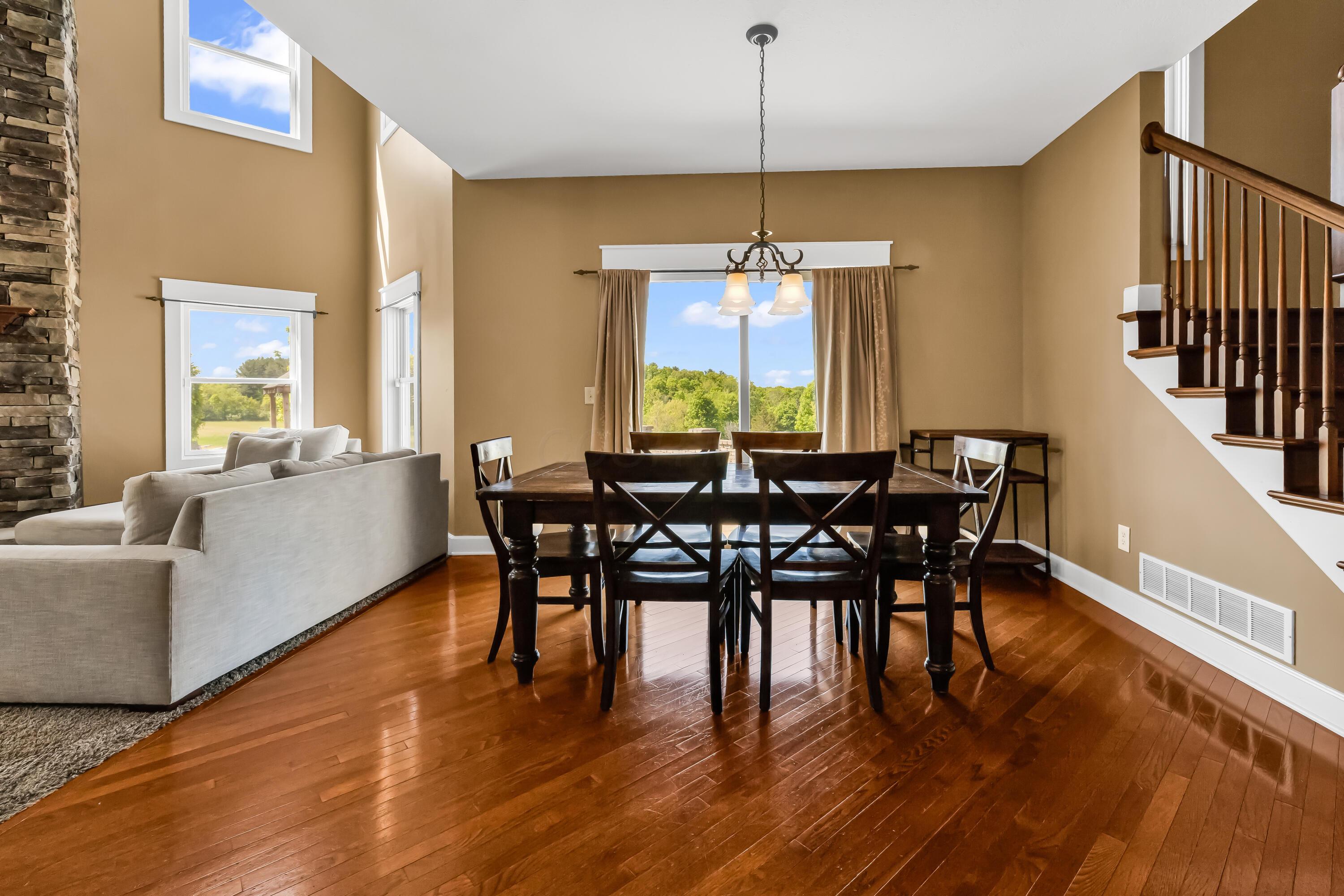 16689 Bailor Road Laurelville, OH 43135 - Photo 23 of 73 • Hardwood flooring
• Tan painted walls
• Chandelier
• Double sliding
doors to patio