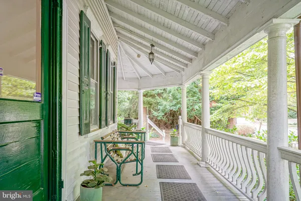 a view of balcony with furniture