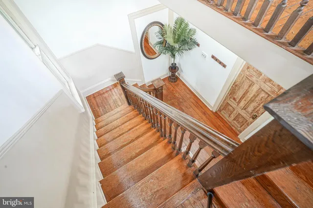 a view of staircase with a rug
