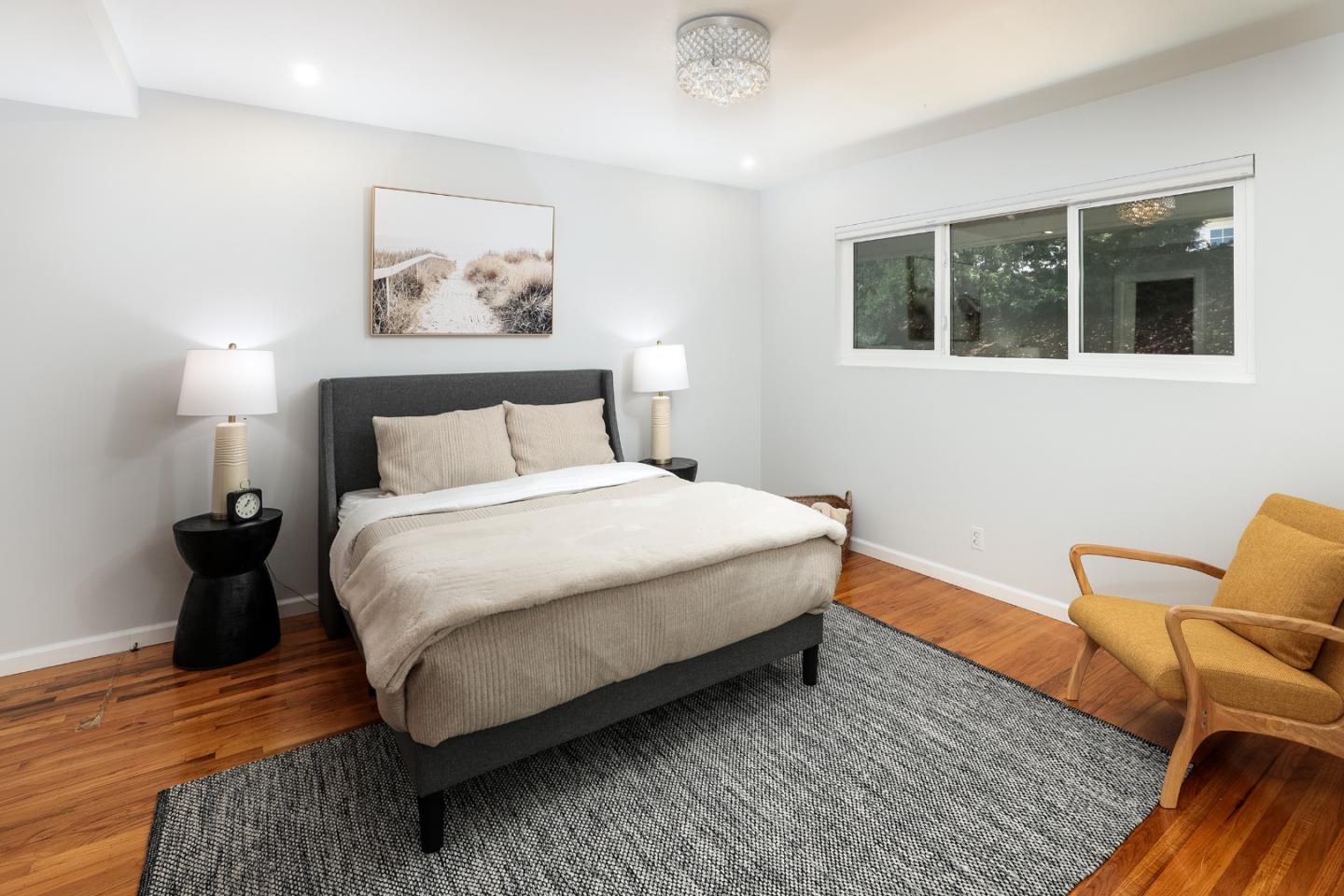 147 Lakeshore Drive San Mateo, CA 94402 - Photo 19 of 36 a bedroom with a bed and wooden floor