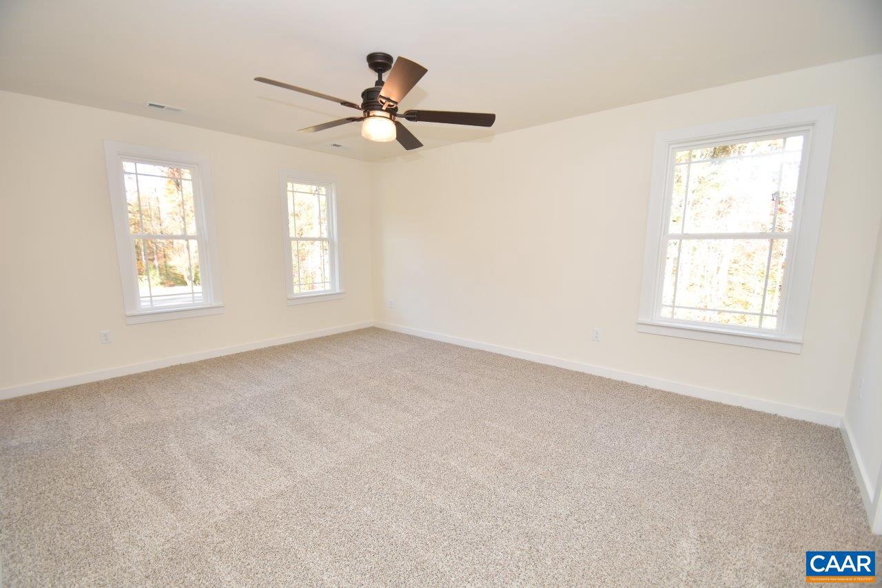 5 Bacon Bit Lane Louisa, VA 23093 - Photo 14 of 27 a view of a livingroom with a ceiling fan and window