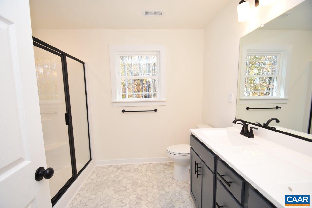 5 Bacon Bit Lane Louisa, VA 23093 - Photo 18 of 27 a bathroom with a sink a toilet and shower