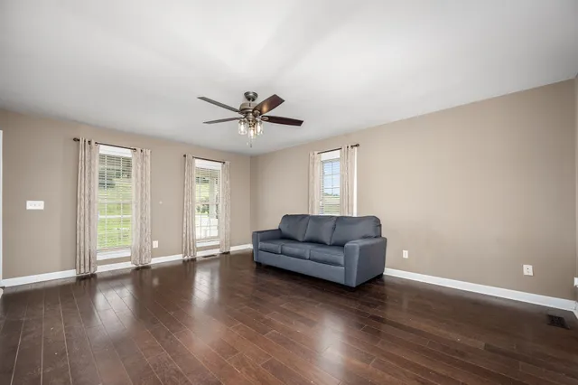 a view of staircase with lots of white walls and a window
