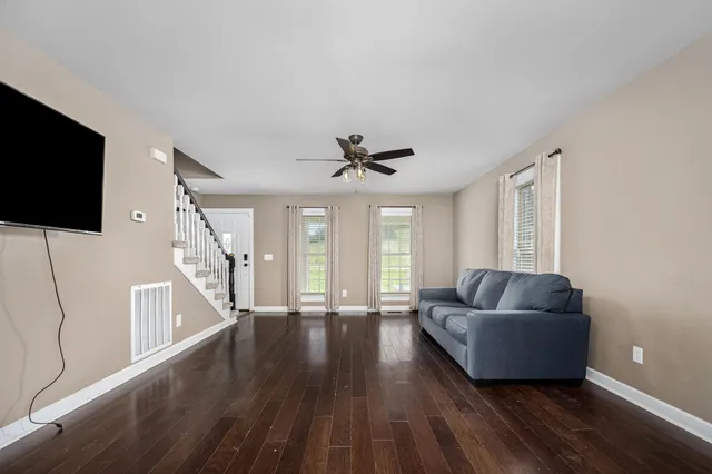 a spacious bathroom with a double vanity sink mirror and toilet