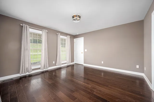 a bathroom with a sink a mirror and a window
