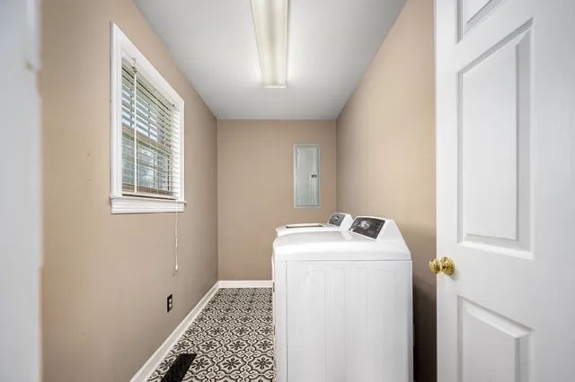 a spacious bathroom with a sink and a mirror