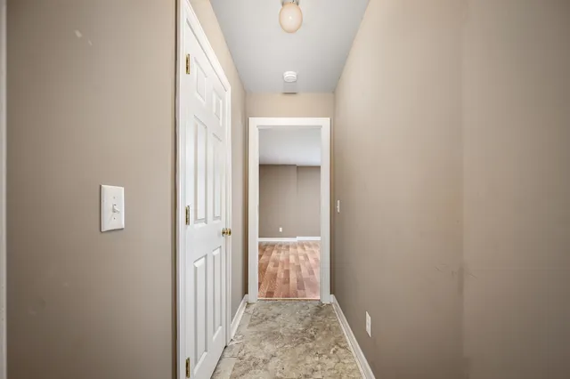 a front view of a house with a yard table and chairs