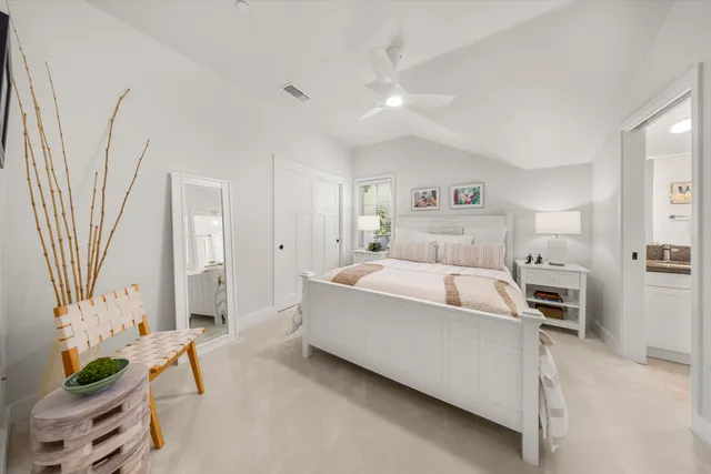 a spacious bedroom with a bed and a couch