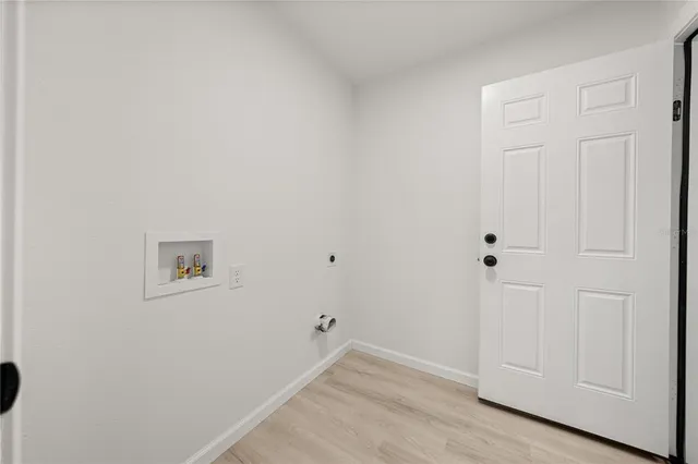 an empty room with wooden floor