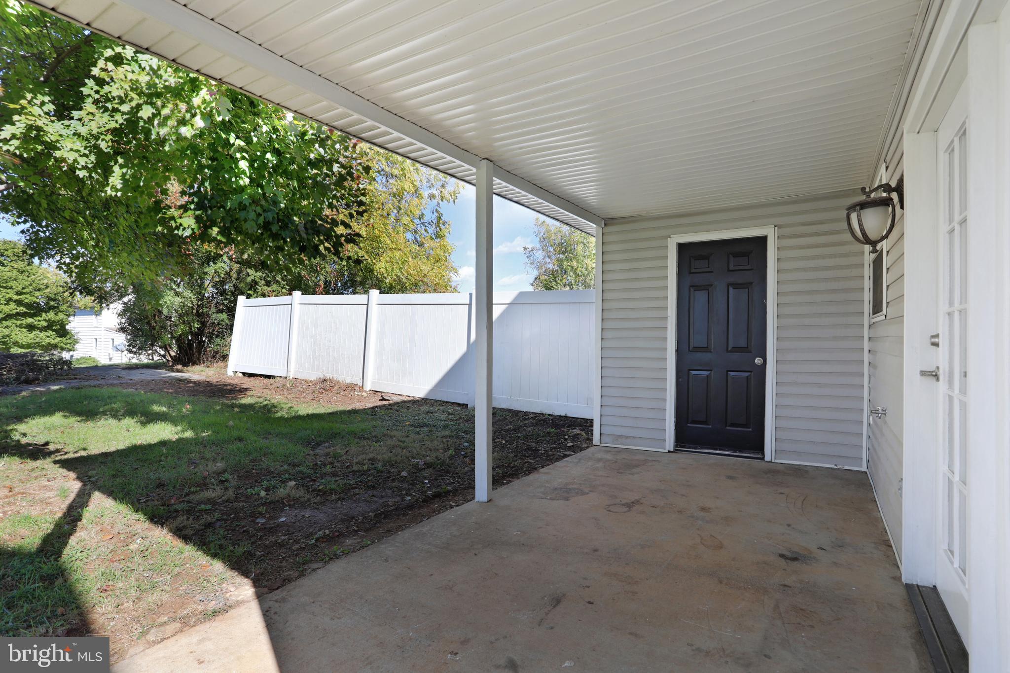 109 East 6th Avenue Ranson, WV 25438 - Photo 8 of 26 COVERED PORCH AND STORAGE