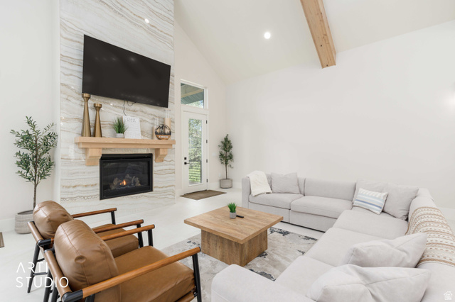 1188 South Old Trappers Loop Road Huntsville, UT 84317 - Photo 25 of 92 Vaulted ceiling living space featuring a floor-to-ceiling fireplace with stone-finish surround and wood mantel