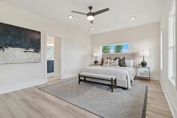 a bedroom with a bed and a mirror