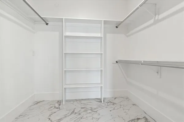 a view of an empty walk in closet