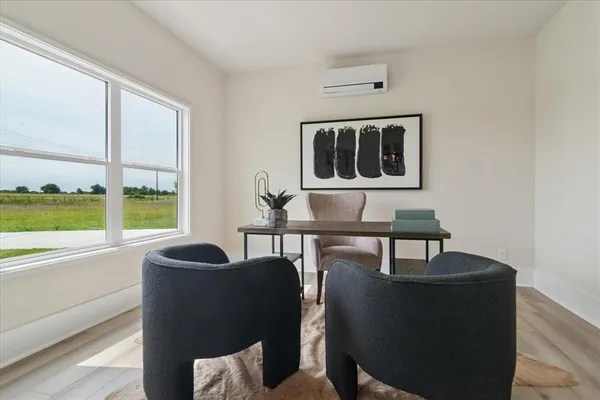 a living room with furniture and a window