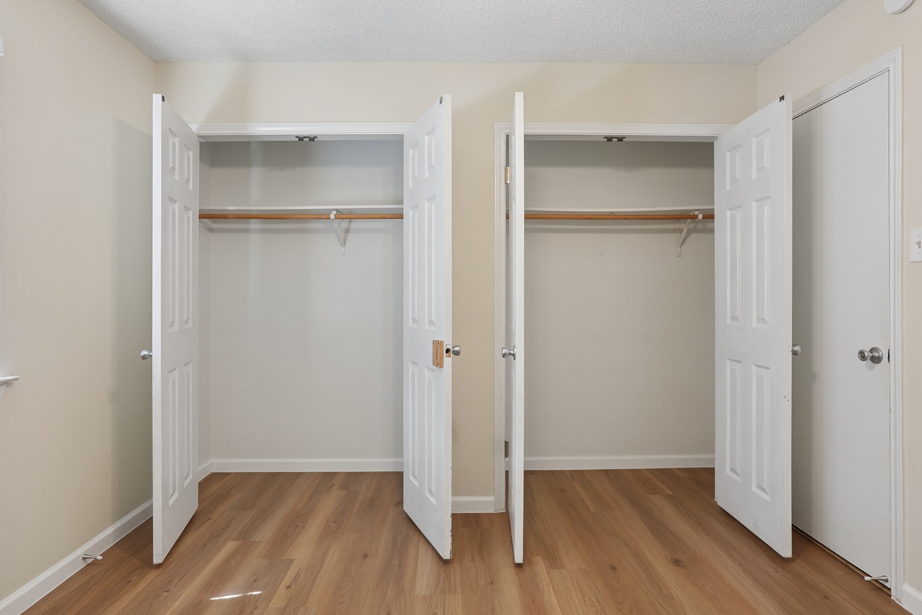 3114 Plantation Road, Unit A Austin, TX 78745 - Photo 13 of 15 Two convenient closets with ample hanging space complement the durable wood flooring.