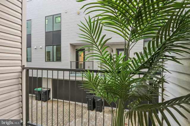 a kitchen with a stove a table and chairs in it