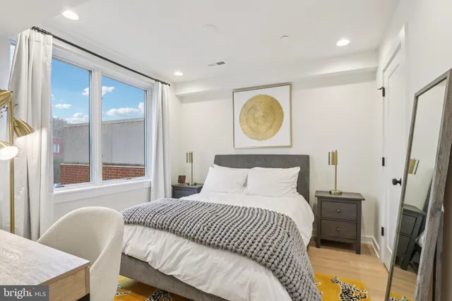 a bedroom with a bed and a dresser