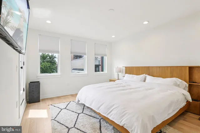 a bedroom with a bed and a lamp