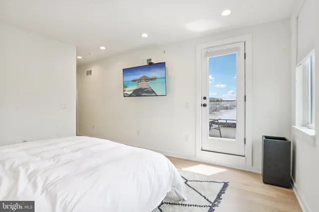 a bathroom with double vanity sinks and a mirror