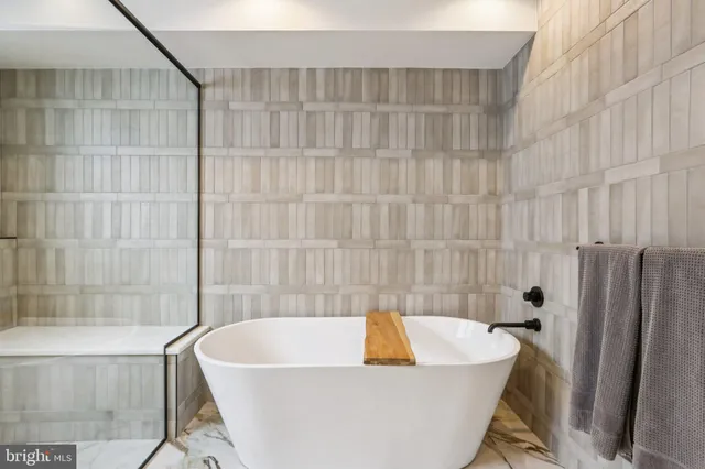 a bathroom with a shower sink and mirror