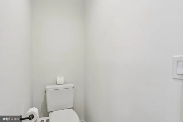 a bathroom with a double vanity sink mirror and shower