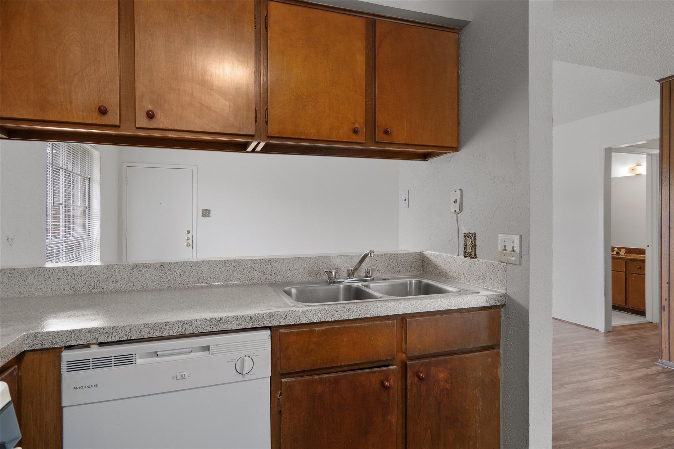 5304 Indio Circle, Unit B Austin, TX 78745 - Photo 13 of 27 a sink with granite countertop cabinets