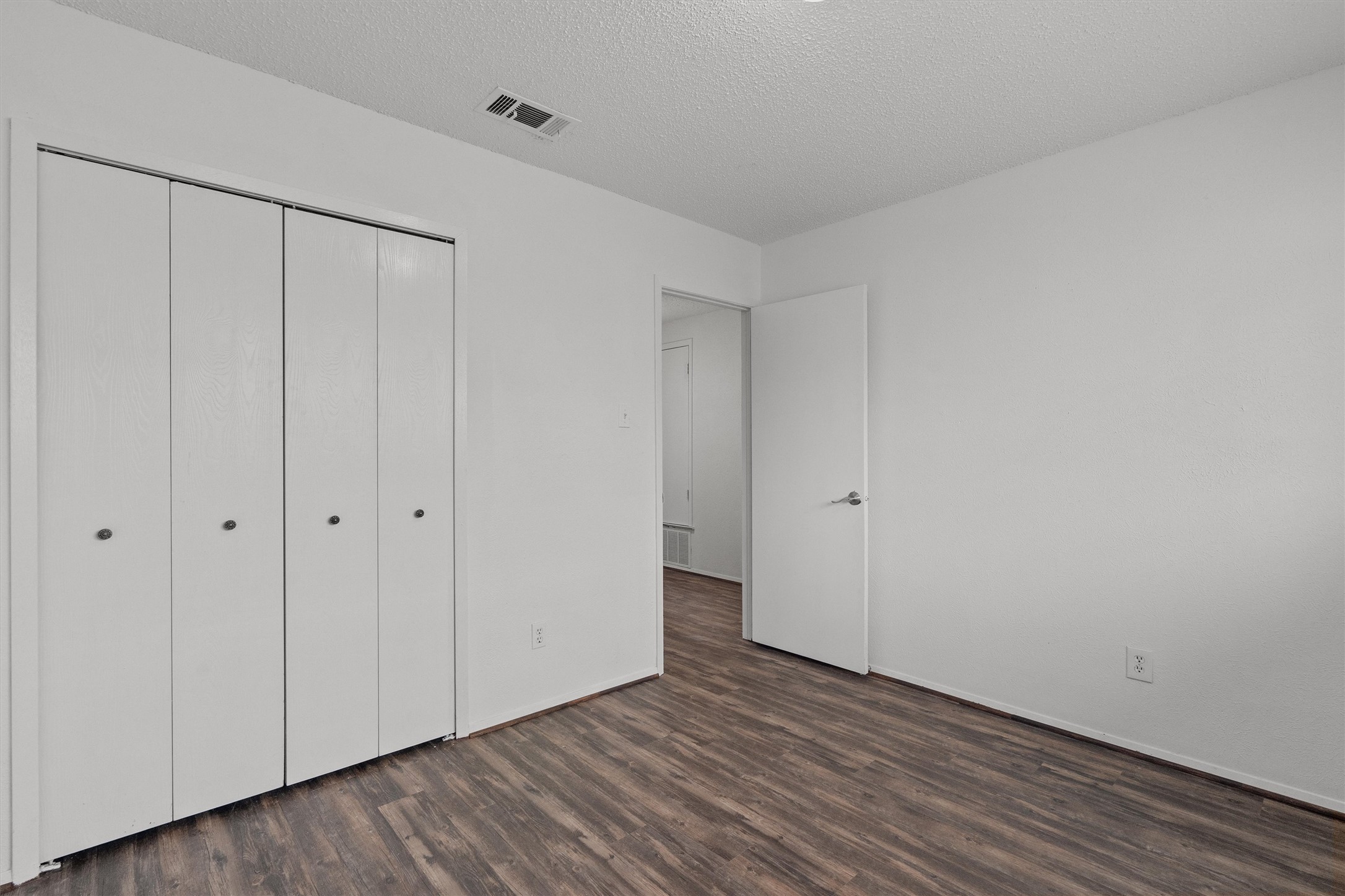 5304 Indio Circle, Unit B Austin, TX 78745 - Photo 20 of 27 a view of an empty room with wooden floor