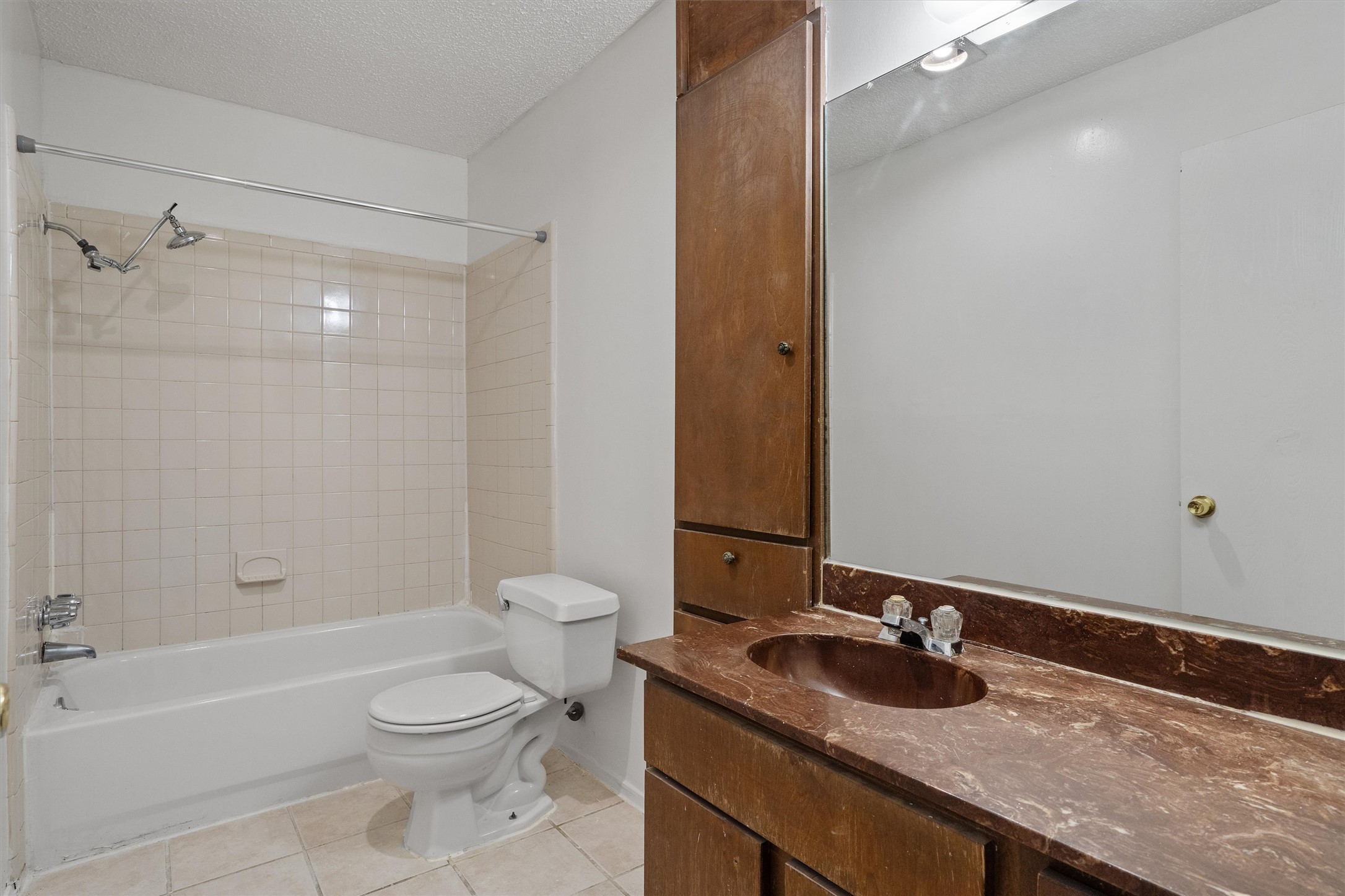 5304 Indio Circle, Unit B Austin, TX 78745 - Photo 23 of 27 a bathroom with a granite countertop sink toilet and shower