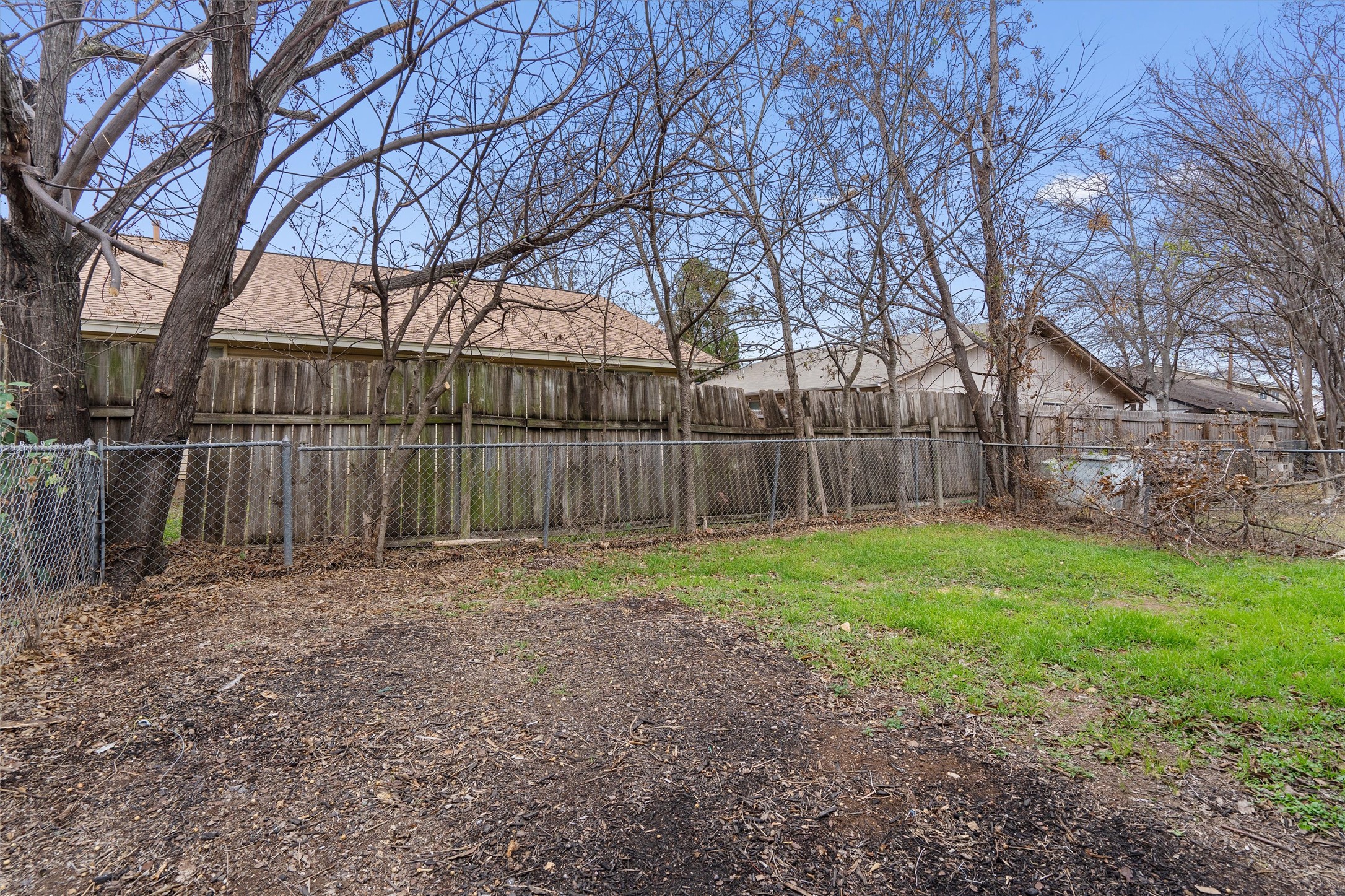 5304 Indio Circle, Unit B Austin, TX 78745 - Photo 26 of 27 a backyard of a house with lots of green space