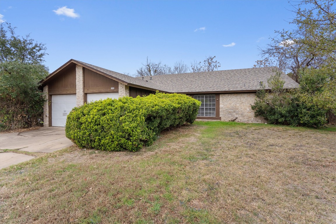 5304 Indio Circle, Unit B Austin, TX 78745 - Photo 3 of 27 a view of a house with a yard and potted plants